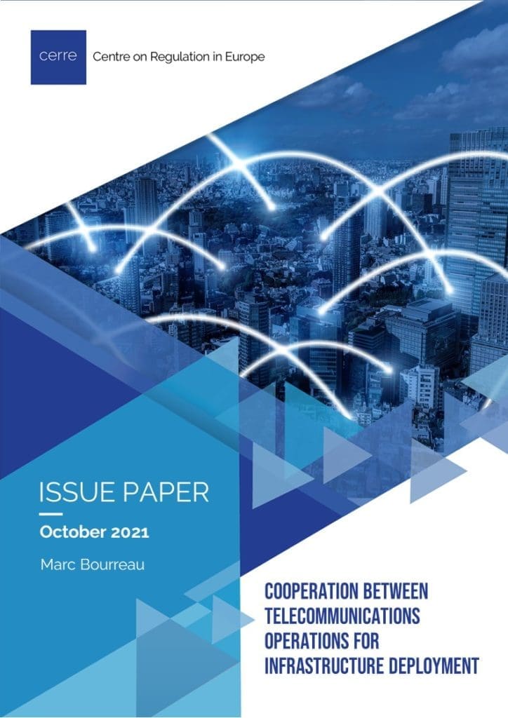 Cover of a publication. Blue and white abstratck image of lights over a cityscape.